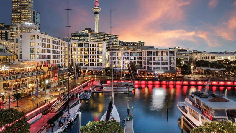Auckland’s waterfront dining precinct illuminated at sunset