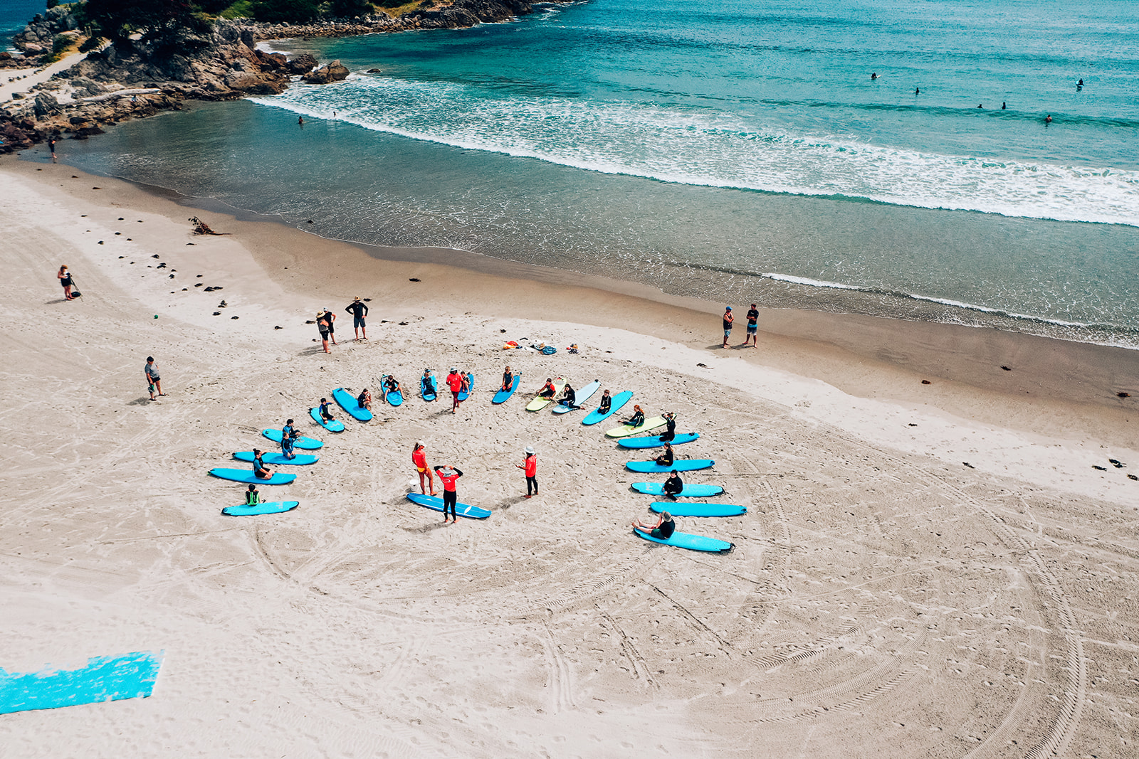 A group surfing lesson on the beach near Matakana