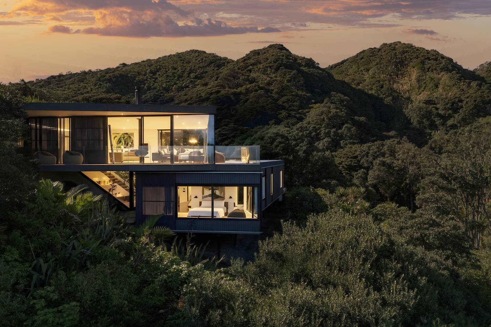 Expansive views from The Watchman’s House across Karekare Beach and the Waitākere Ranges